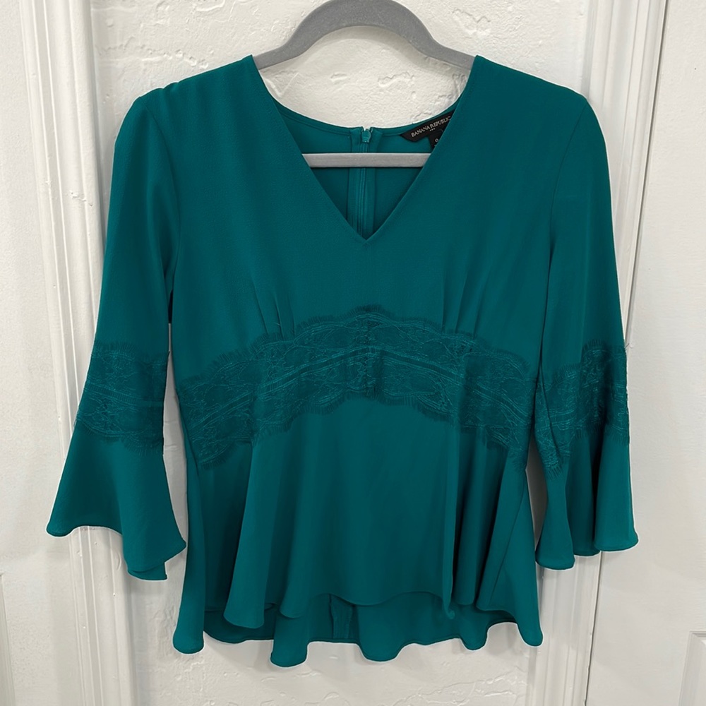 Stunning turquoise blouse with lace